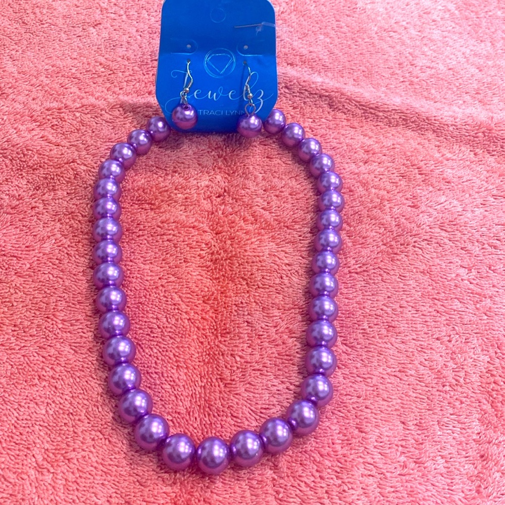 Purple color pearls with matching earrings